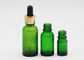 Bouteilles de compte-gouttes d'huile essentielle de couleur verte de soins de la peau avec le compte-gouttes en aluminium
