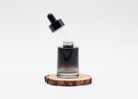 Cosmétique en verre de cylindre d'huile essentielle de bouteille de sérum noir de luxe de compte-gouttes